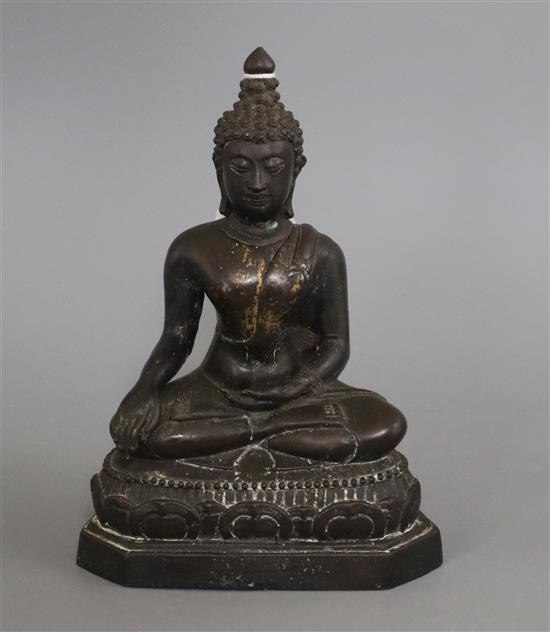 A Thai brown patinated bronze seated figure of Buddha H. 20.5cm